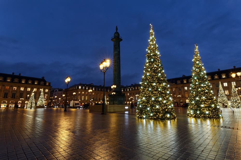 Place Vendome decorated for Christmas with trees and the statue of Napoleon