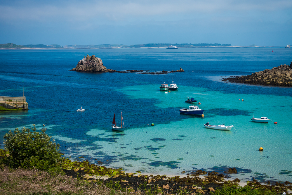 Porth Conger, St Agnes, Isles of Scilly you can see boats in the water and you can see rocks. It's one of the places in southern England. 