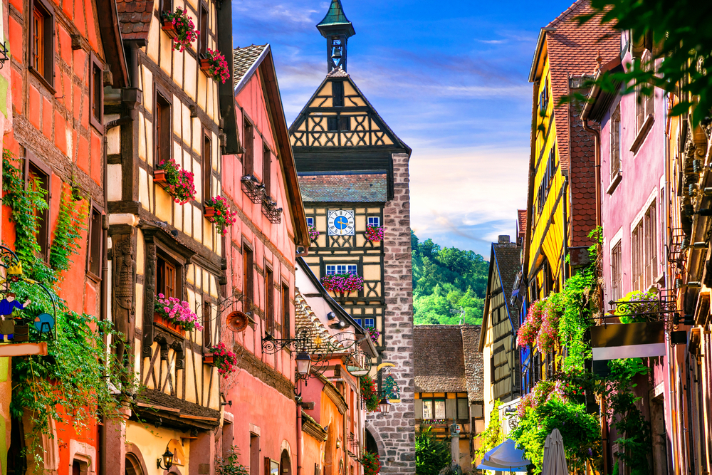 Riquewihr in Alsace. Famous vine route and tourist " romantic road". Picture shows colouful old houses in and artcile about small towns in France. 