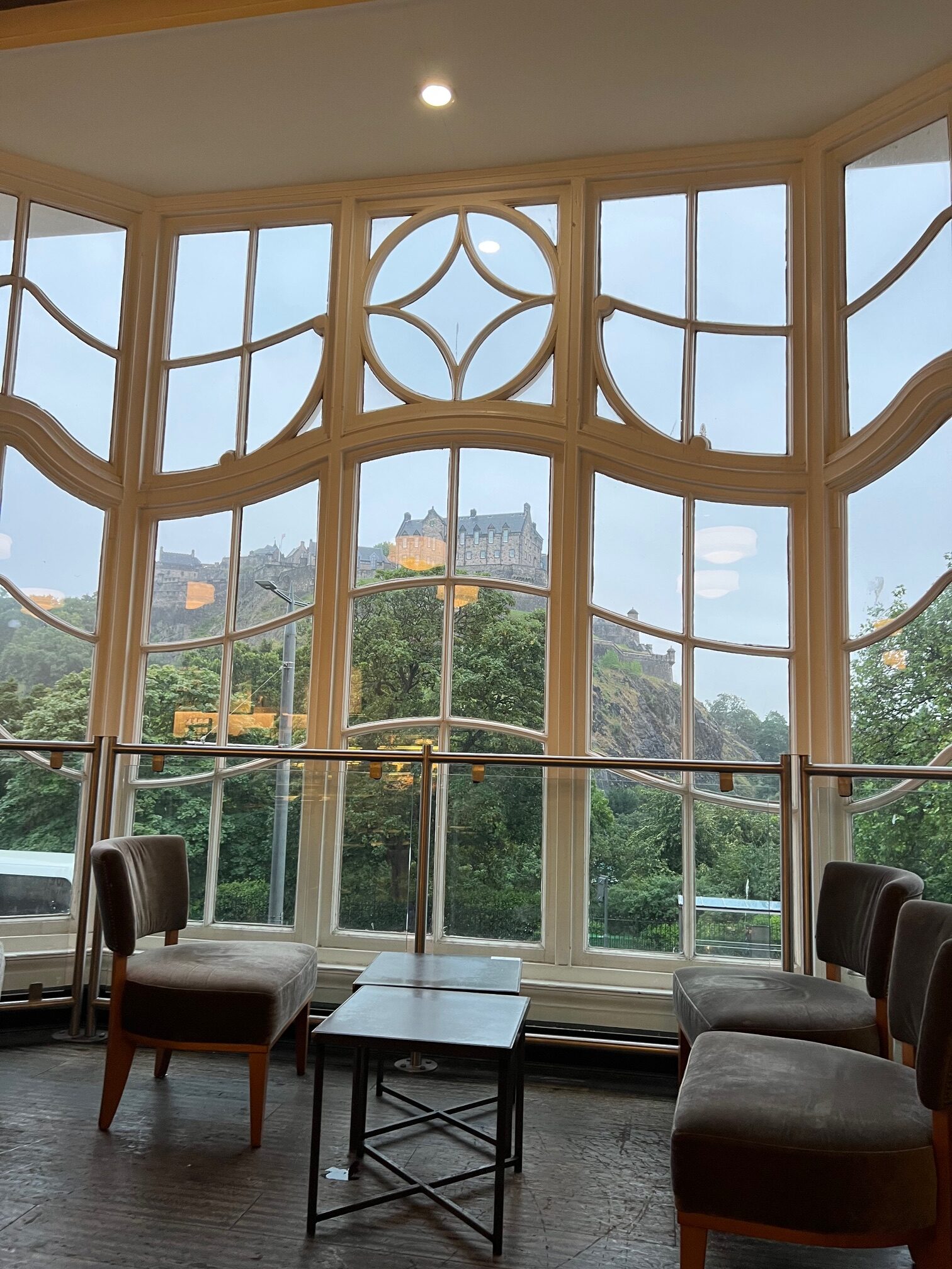 a view through the window of one of the cafes in Edinburg where you can see the Caste