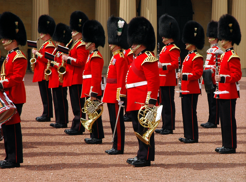 The British guards in the iconic red and black dress with hats at the changing of the guard ceremony