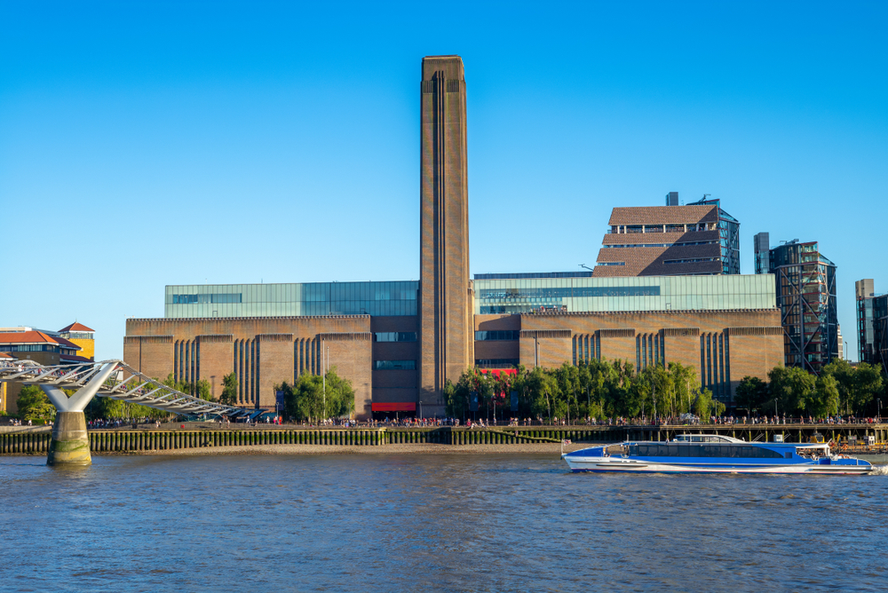 The exterior of the Tate Modern a free museum in London from across the Thames river