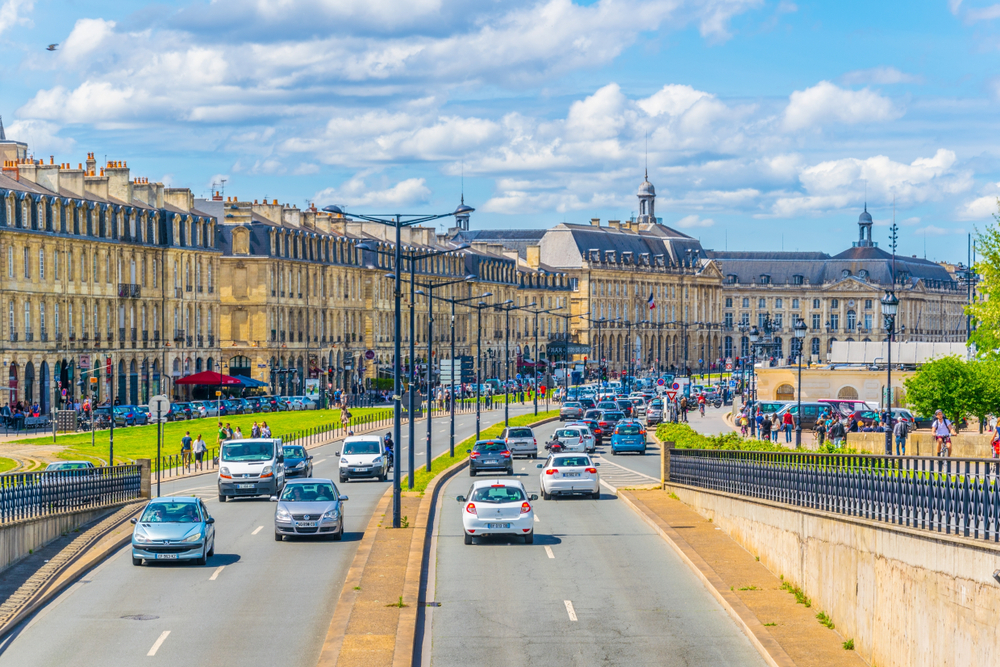 Car driving on a major road in Bordeaux on a France road trip.