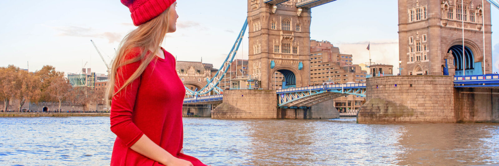 A girl in red with tower bridge in background