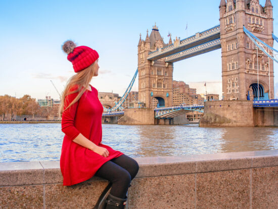 A girl in red with tower bridge in background