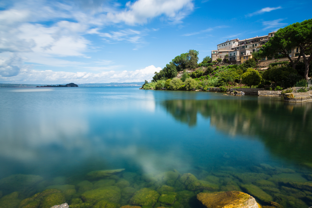 View of Bolsena Lake from Capodimonte. You can see a house on the side of the shore.  