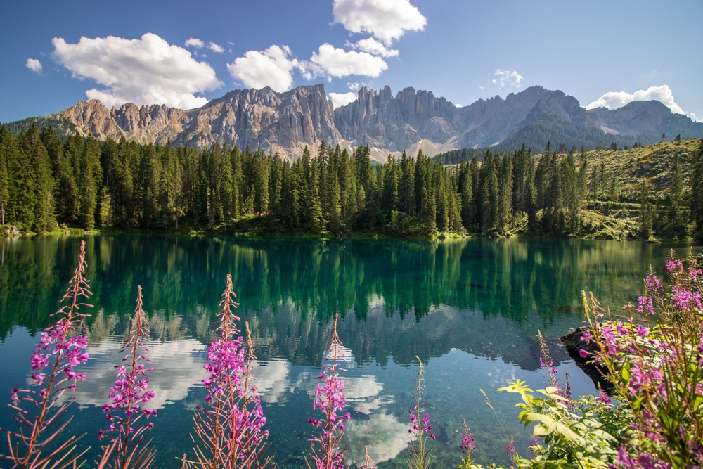 Beautiful blue lake in the Dolomites of Trentino Alto Adige, Nova Levante. Paradise landscape at Karersee with mountain Latemar. Italy.