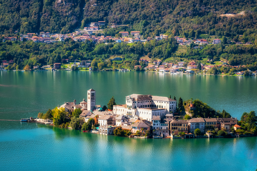 The world famous Orta San Giulio island, in the Orta Lake (piedmont, Northern Italy) seen from the top of Sacro Monte di Orta. One of the lakes in Italy. 