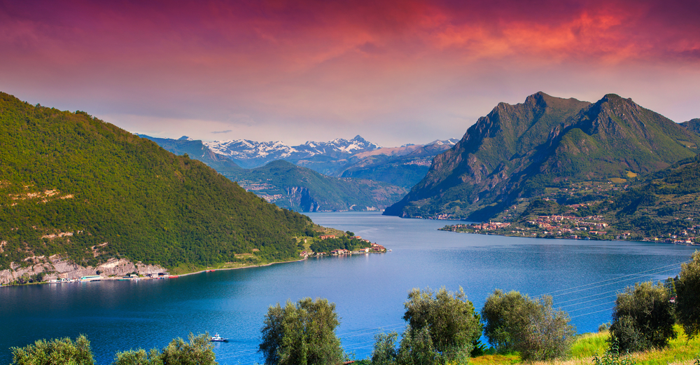 View of the Lake Iseo, on a colorful sunny morning. You can see the mountains in the background on the lake. 