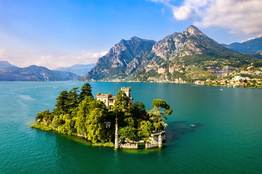 Aerial view of Loreto Island with the castle on Lake Iseo in Northern Italy. The article is about lakes in Italy. 