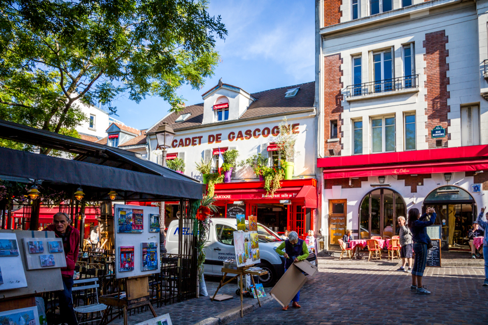 Terraces of restaurants on Place du Tertre at the Butte Montmartre. You can see artits and their work. 