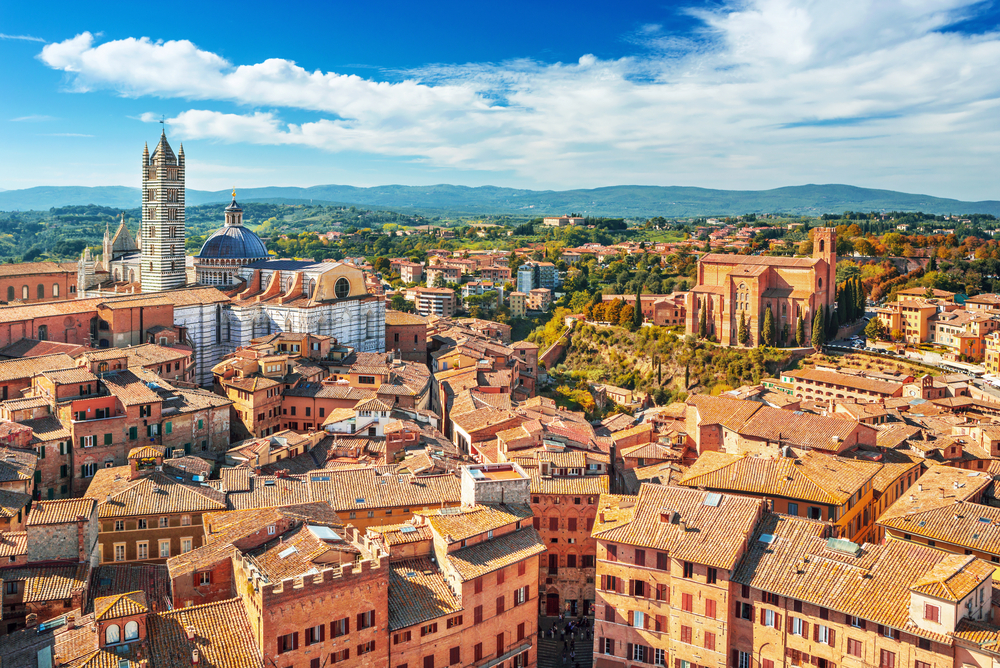 Scenery of Siena, a beautiful medieval town in Tuscany, with view of the Dome & Bell Tower of Siena Cathedral (Duomo di Siena), landmark Mangia Tower and Basilica of San Domenico,Italy