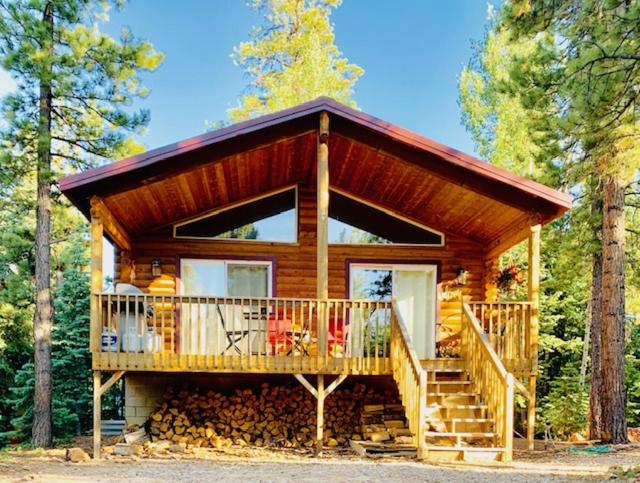 View of a log cabin with covered porch near Zion National Park