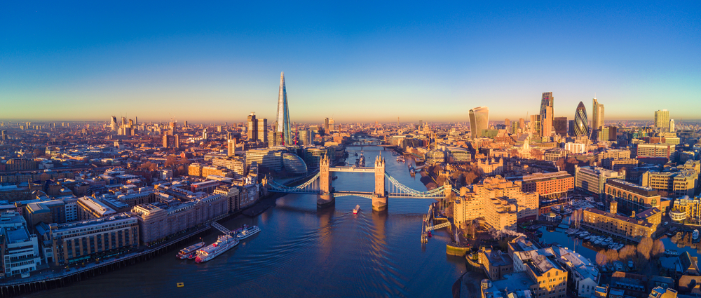 an ariel view of the city of London at dusk  as you learn how to spend The Perfect 4 day London itinerary 