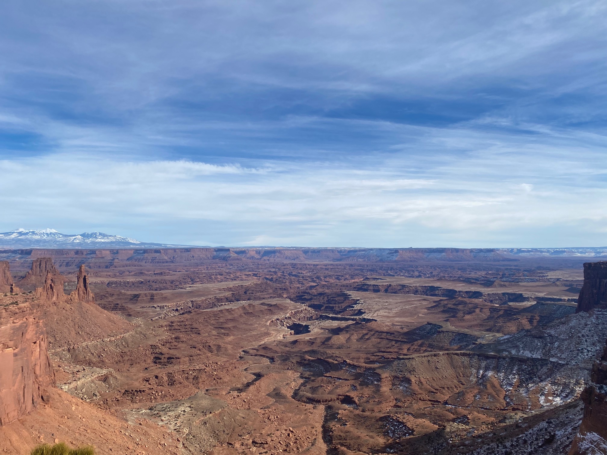 Vast, panoramic view looking down at canyons and mesas in Canyonlands National Park.
