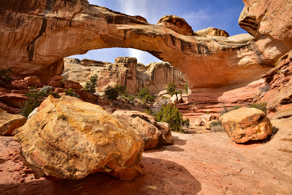 Hickman Bridge arch with large boulders in the foreground.