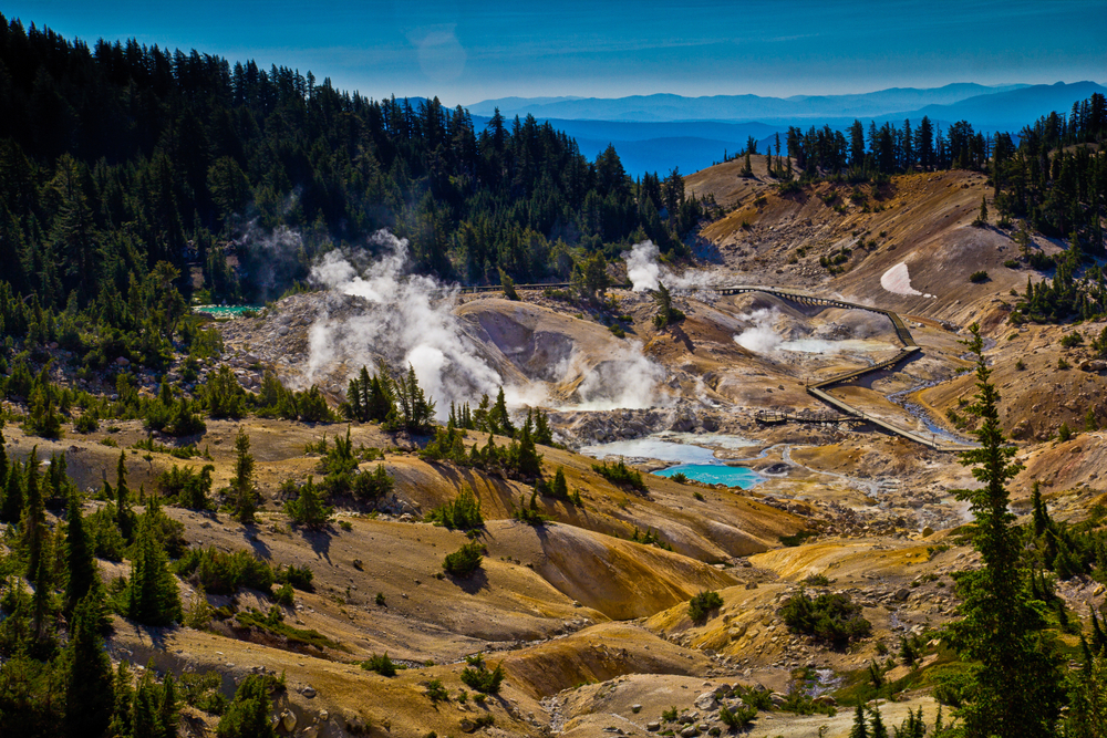 View down into steaming Bumpass Hell with a boardwalk in Lassen Volcanic National Park.