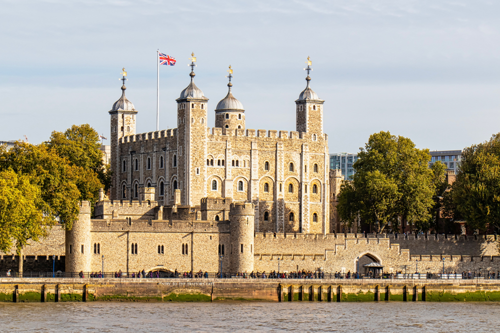 The Tower of London taken from across the water. The union jack is flying. 