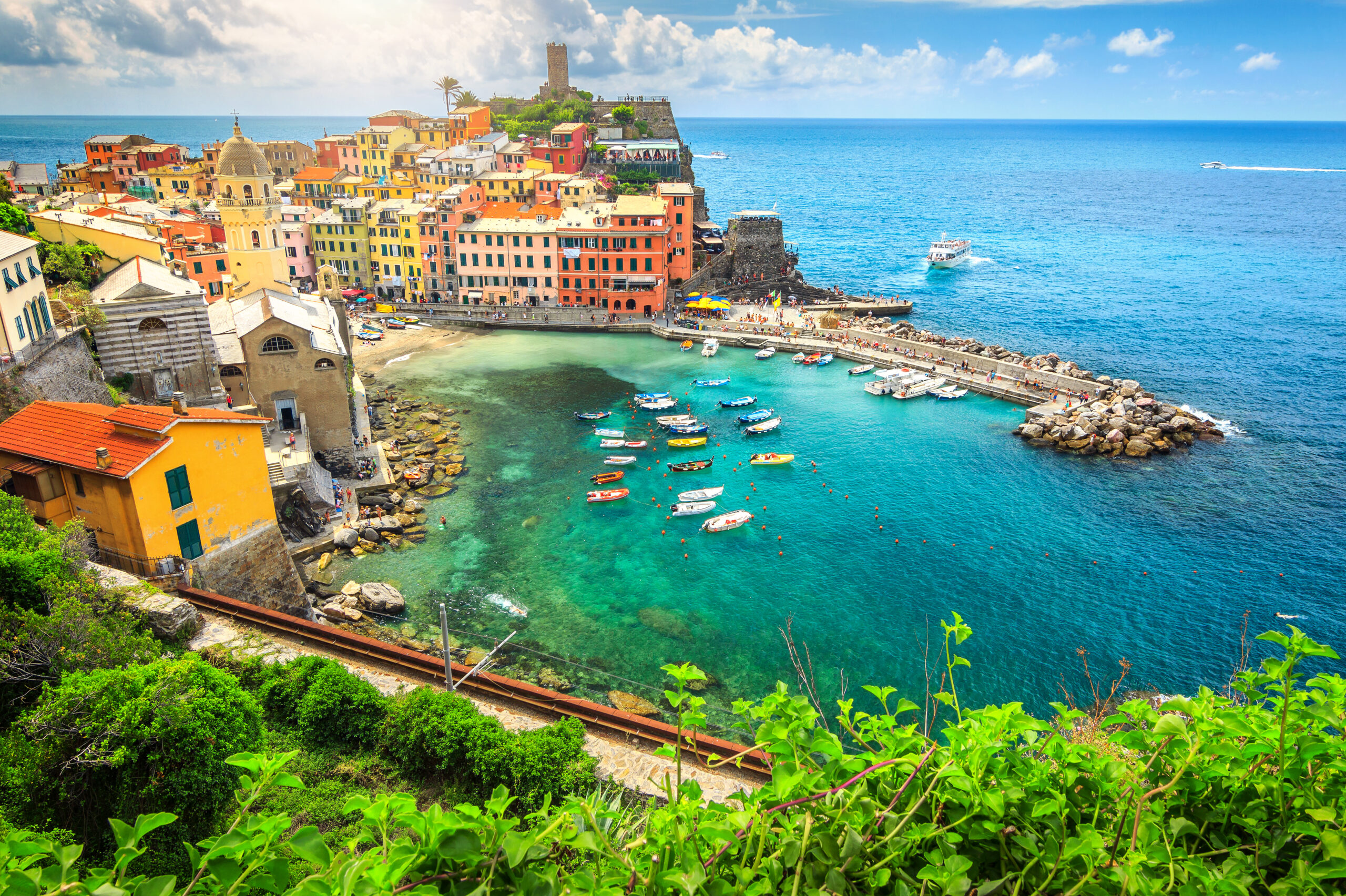 Super colorful image of one of Cinque Terre's epic beach views at Vernazza Beach. 