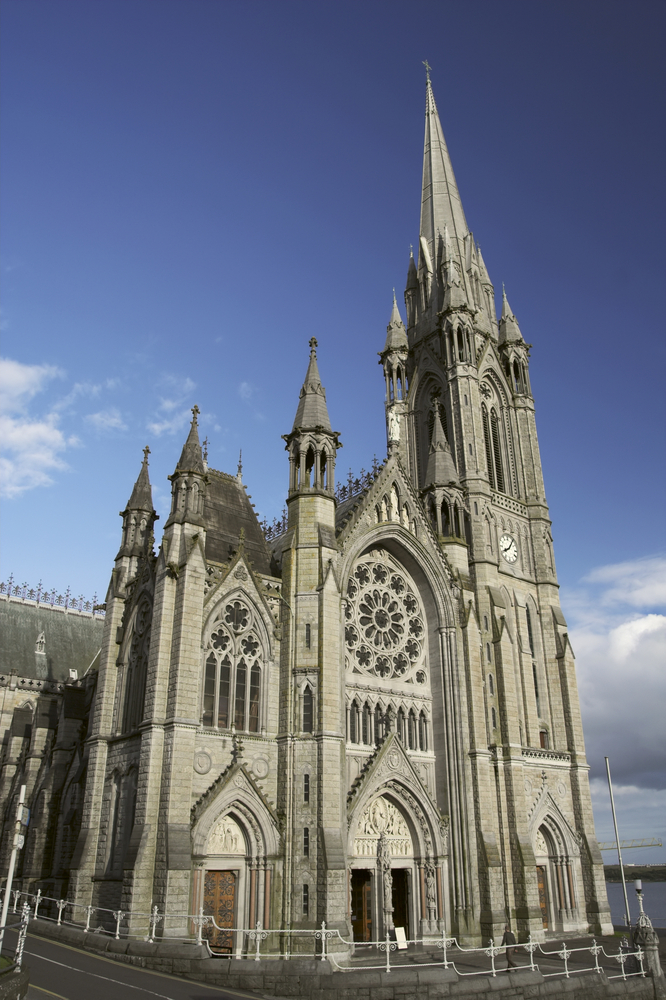 St. Colman's neo-Gothic cathedral against a blue sky. 