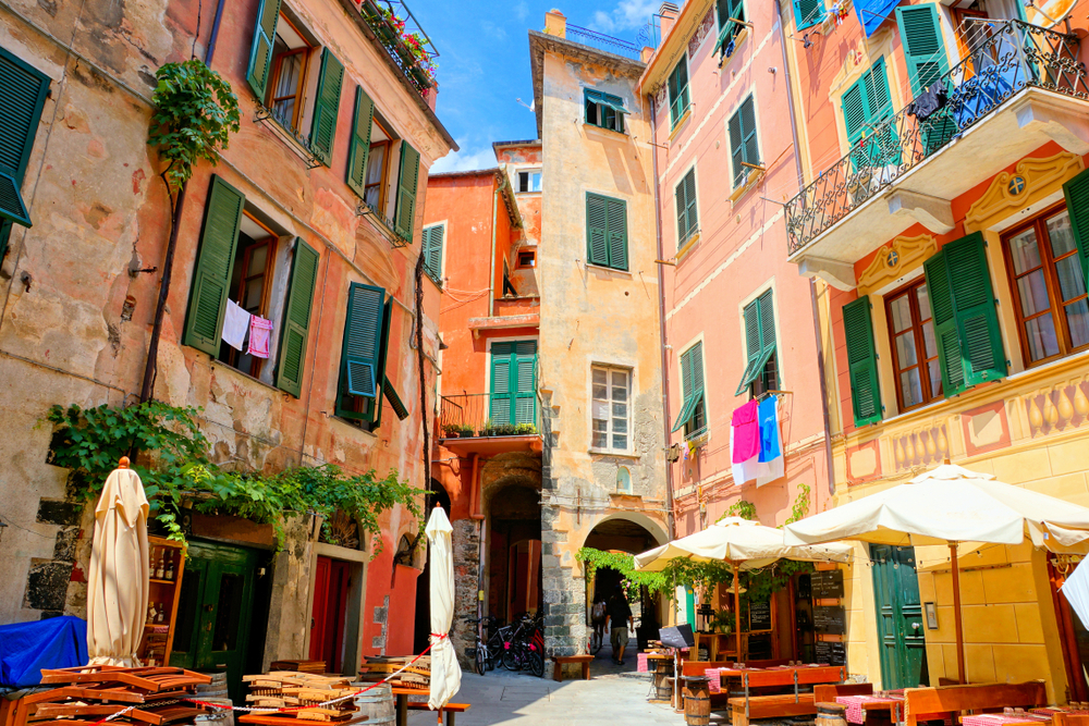 Colorful square with restaurant tables in the Cinque Terre village of Monterosso, Italy
