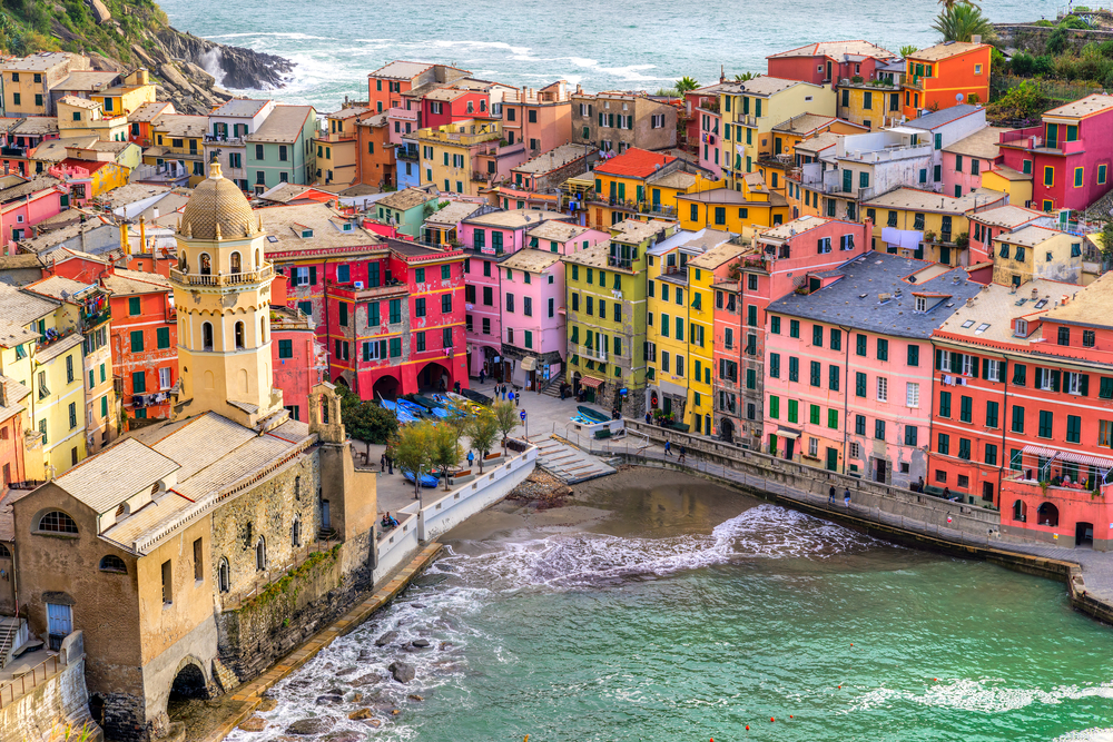 Cinque Terre National Park showing colorful houses against the ocean. The articles is about things to do in Cinque Terre. 