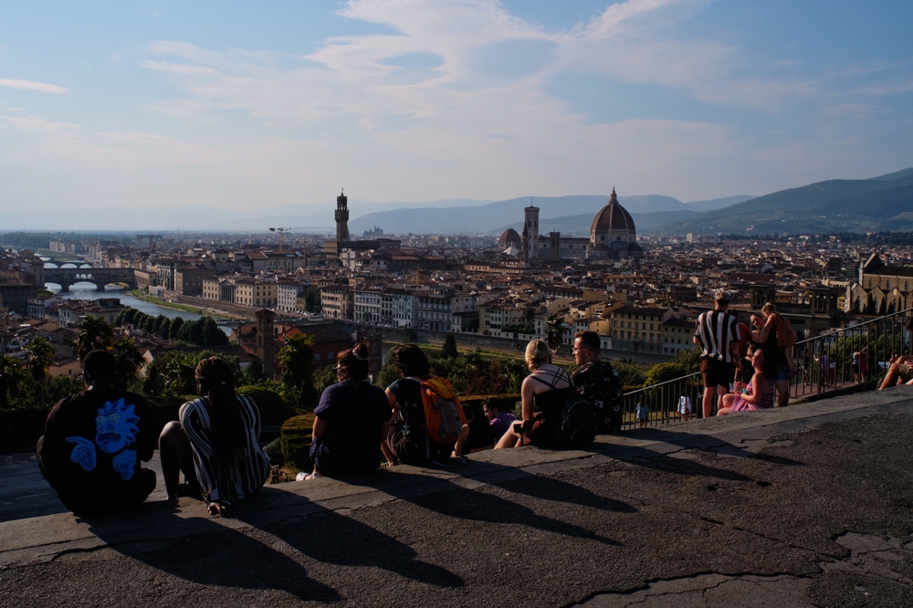 sunset with crowds watching from Michalengo's steps