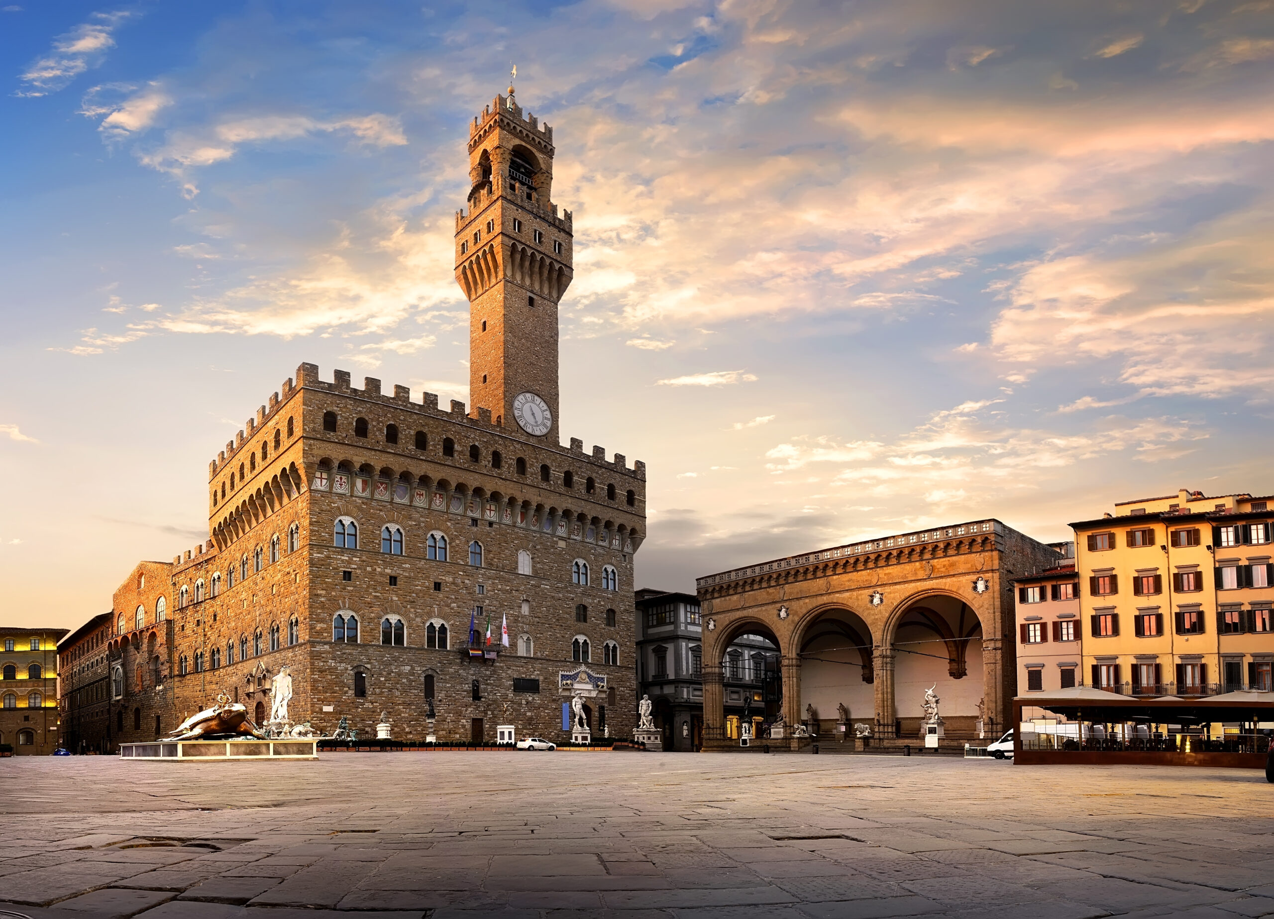 the Square of Signoria in Florence at sunrise where stunning stone building off Palazzo Vecchio can be seen