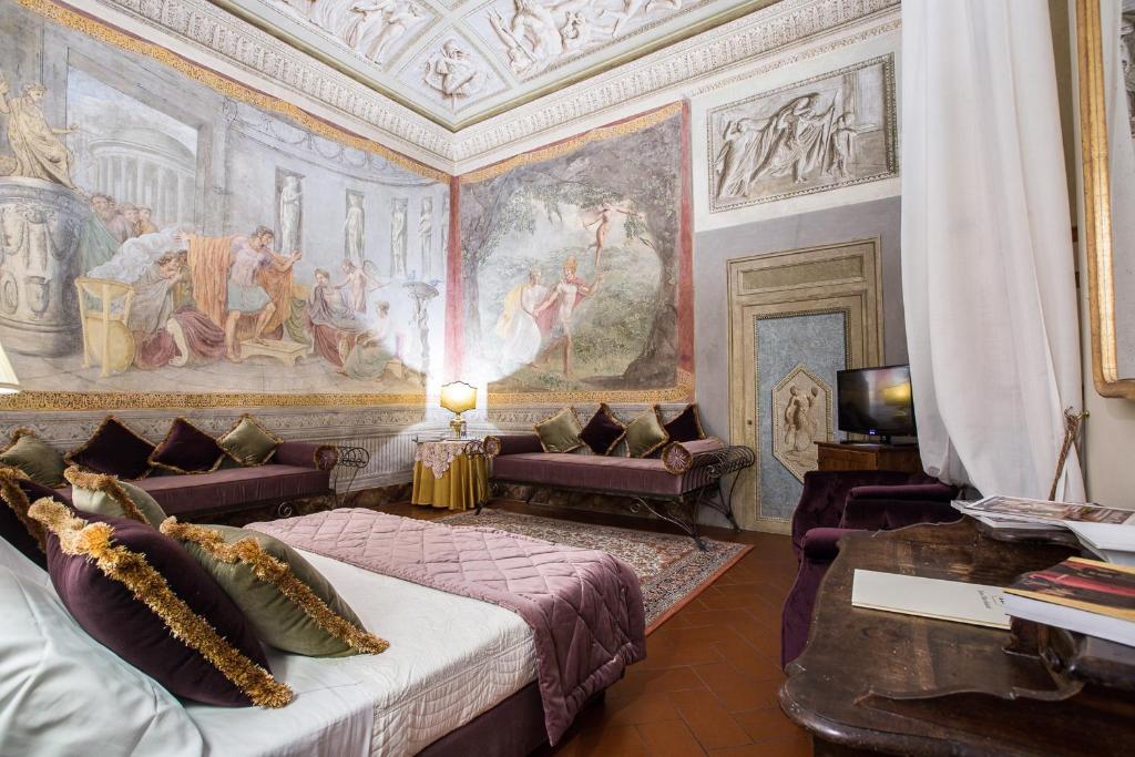 the hotel rooms feature original painted frescos in the room with lush fabrics