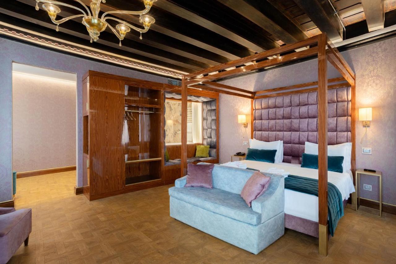 the Luxury rooms at Hotel Dona Palace in rich jewel tones and wooden floors