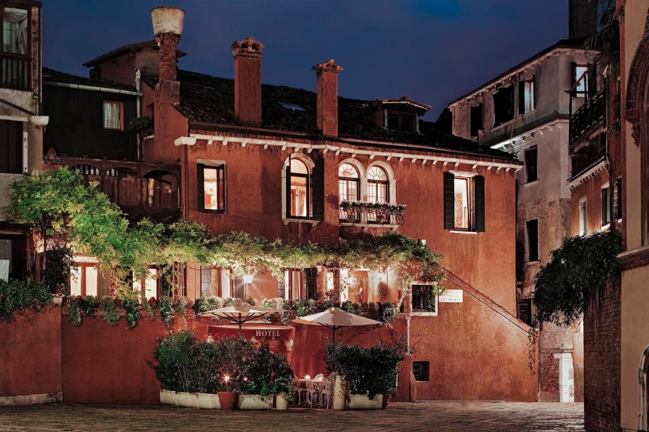 The exterior of the Locando hotel with its red bricks the perfect place to stay on your one day in Venice itineary