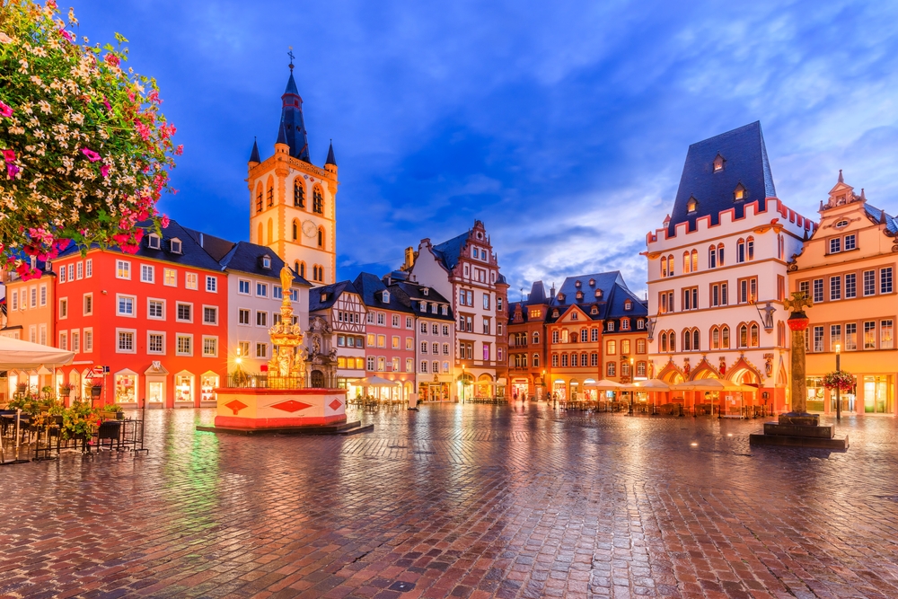 Trier, Germany. Hauptmarkt market square and St. Gangolf church at night. 