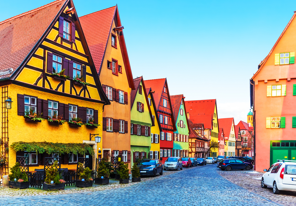 Scenic view of ancient medieval urban street architecture with half-timbered houses in an article about small towns in Germany. 