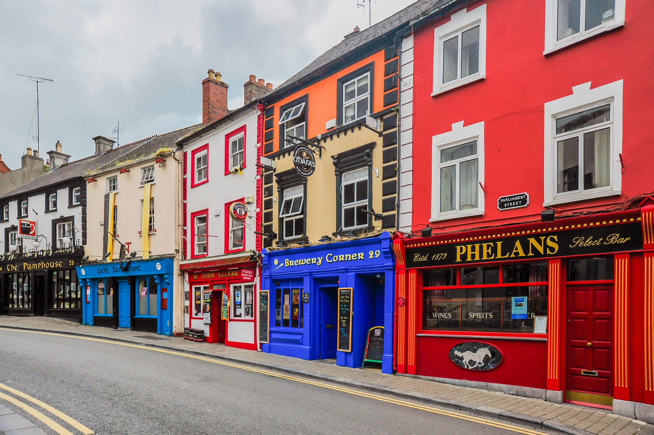 View of a colorful row of vintage pubs in Kilkenny Ireland