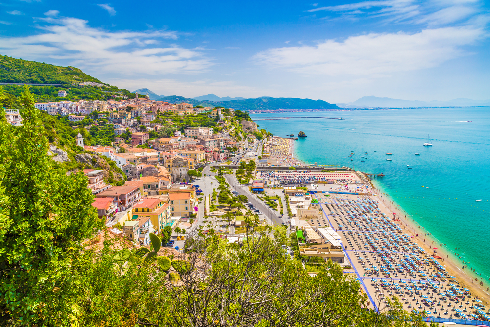 The beach town of Vietri Sul Mare is one of the best beaches on Amalfi Coast, overlooking the turquoise water and large sandy beach with chairs and umbrellas set up