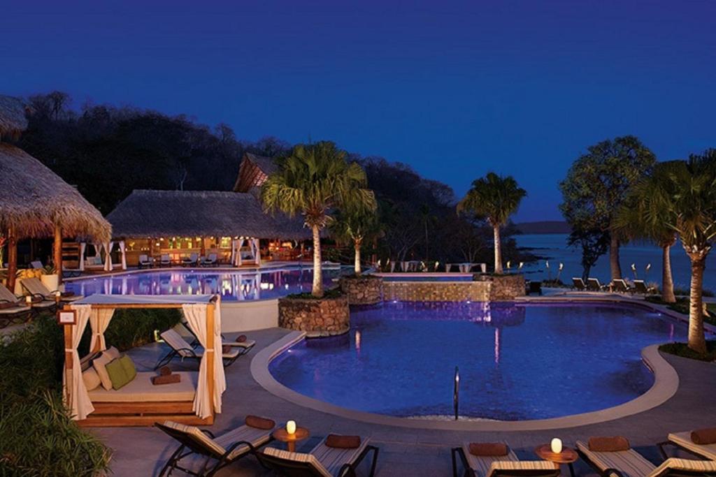 View of the pools and chairs around of one of the best adults only all inclusive resorts. 