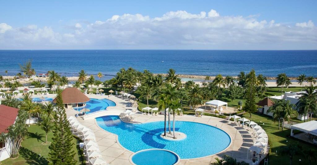 pool with ocean in the background at one of the most affordable all inclusive resorts to visit