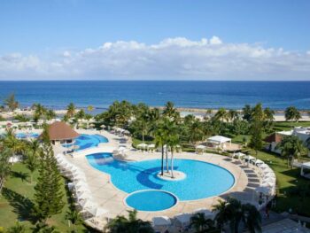 pool with ocean in the background at one of the most affordable all inclusive resorts to visit