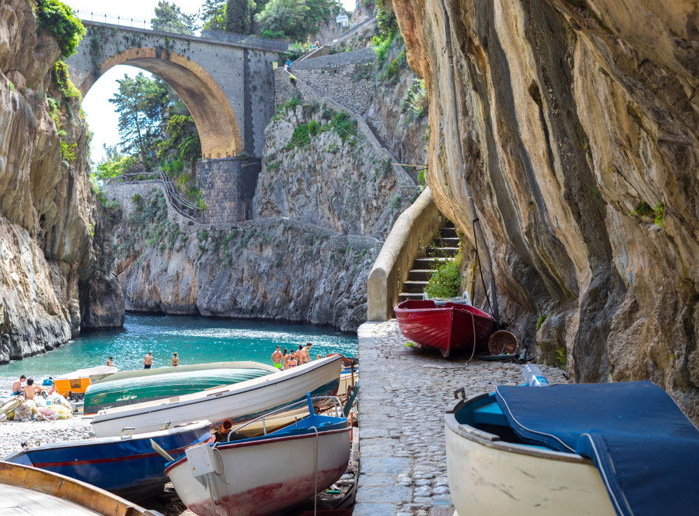 Fiordo di Furore has a bridge overhead with cliffs on both sides and a beach below