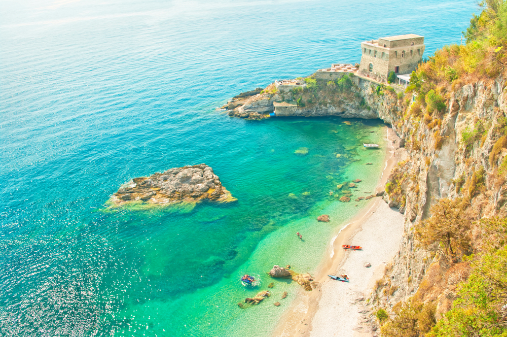 the small picturesque town of Erchie has population of 80 people looking down on the turquoise water