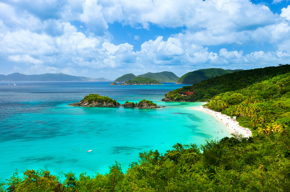 St. Johns features paradise-like views, with tons of greenery on the island that contrasts the light blue water and a pale shoreline.