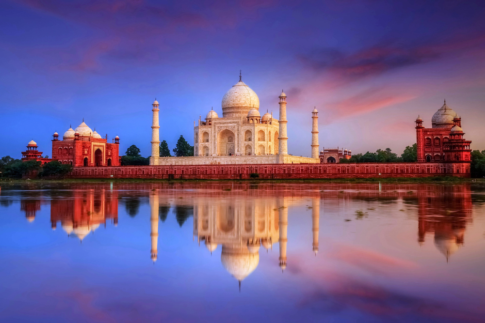 The Seven Wonders of the World Taj Mahal taken from across the lake at sunset. One of the once in a lifetime destination. 