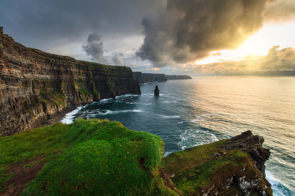 Stormy sunset over the ocean and the Cliffs of Moher.