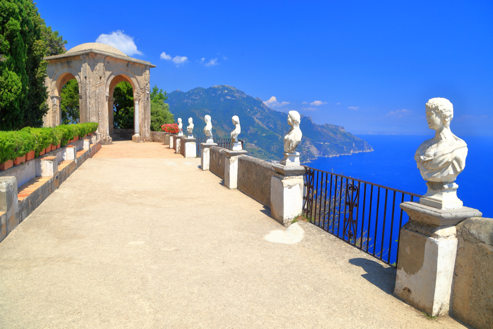 One of the paved garden paths with statues overlooking the ocean below at  Villa Cimbrone
