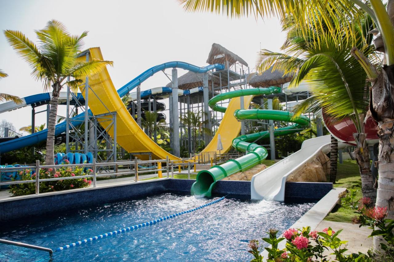 Four epic water slides with curves and hills that land in pool of crystal clear water at Royalton Splash Punta Cana.