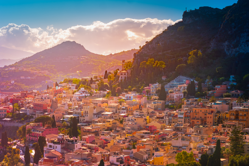 hillside village in italy, one of the best place to visit in europe in december, mountains are in the backhround