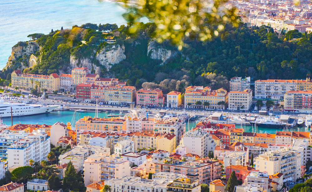 aerial photo of a city on the french riviera, buildings, waterways, and trees are in the photo