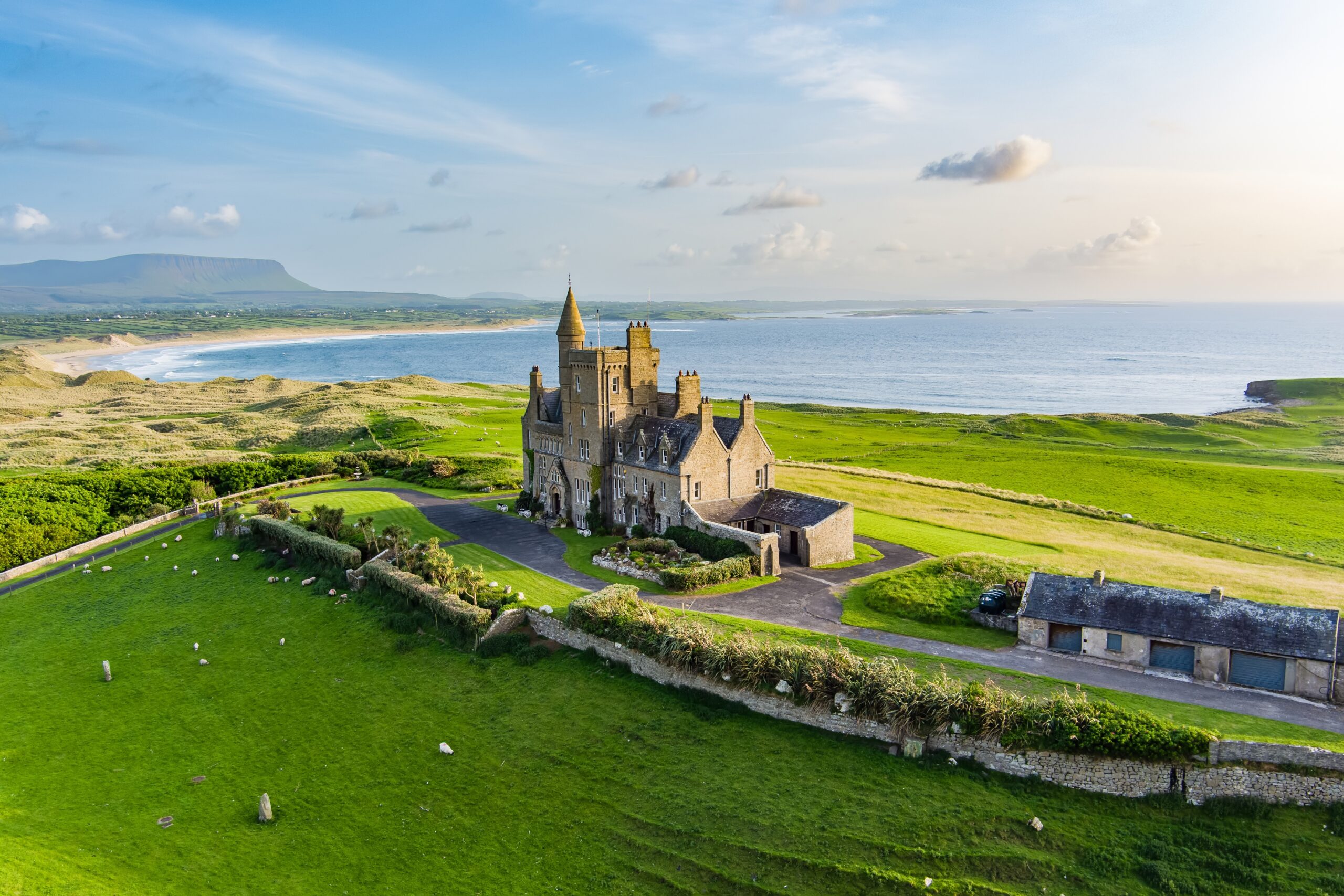 The beautiful seaside and sheep fields surrounding Classiebawn Castle in Ireland 