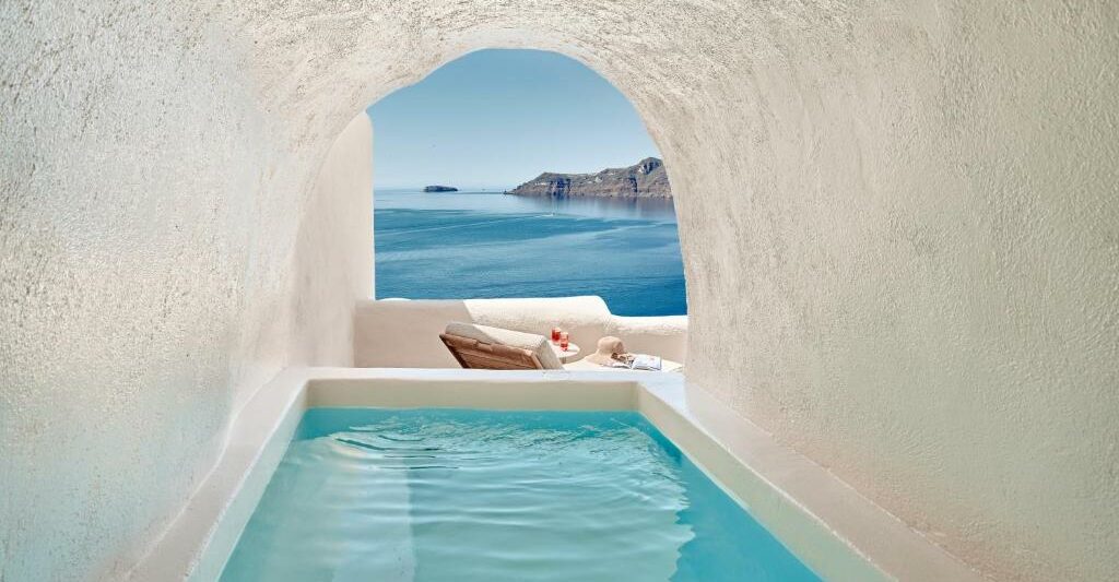 Plunge pool in a cave overlooking the ocean. This is one of the best luxury hotels in Greece.
