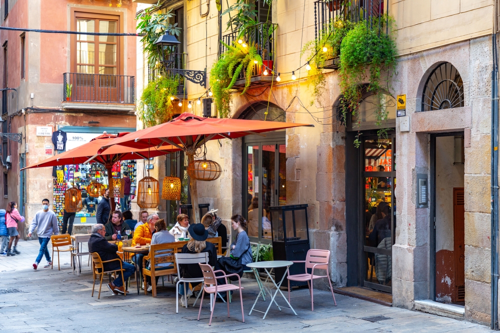 A shot of a casual cafe in Spain shows guests eating and hanging out before siesta!